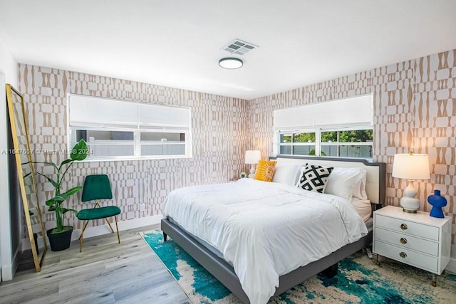 bedroom with light hardwood / wood-style flooring