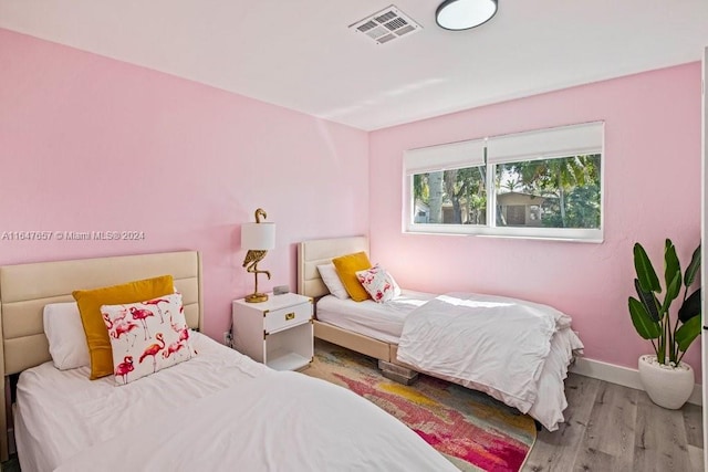 bedroom with light hardwood / wood-style floors