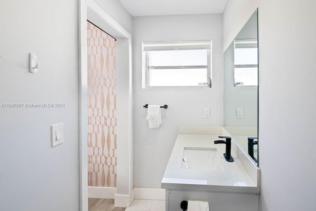 bathroom with vanity and a wealth of natural light