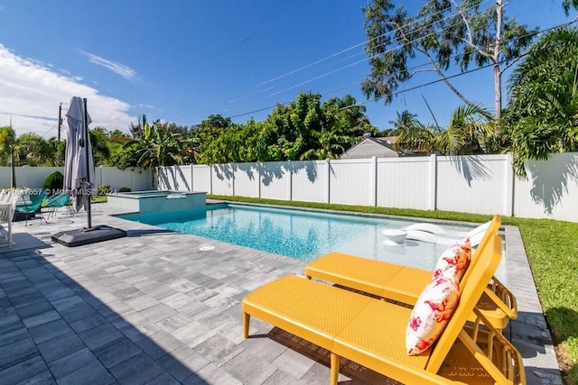 view of swimming pool featuring an in ground hot tub and a patio