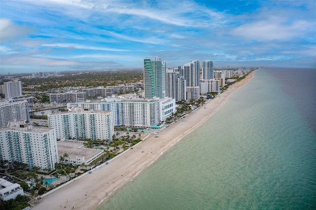 aerial view featuring a view of the beach and a water view