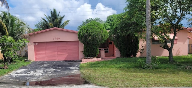 single story home with a front lawn