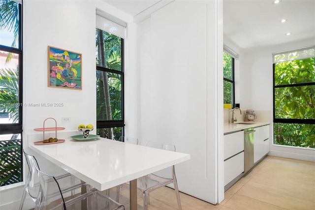 dining room with light tile patterned floors and recessed lighting