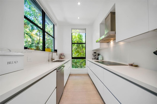 kitchen with a sink, white cabinetry, wall chimney range hood, black electric stovetop, and dishwasher