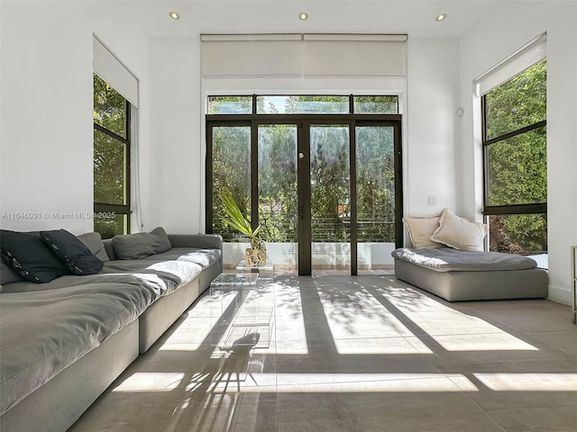 living area featuring recessed lighting and french doors