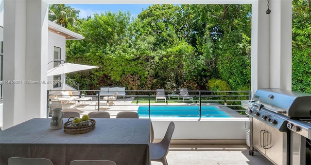 view of swimming pool featuring area for grilling