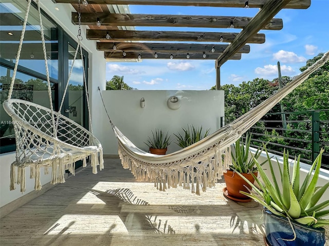 exterior space with a balcony and a pergola