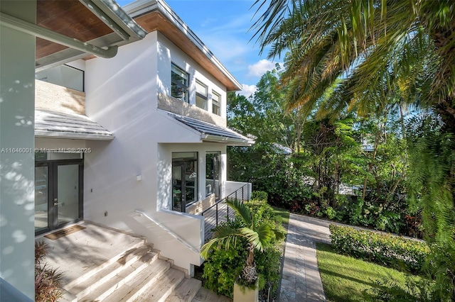 view of side of property featuring stucco siding