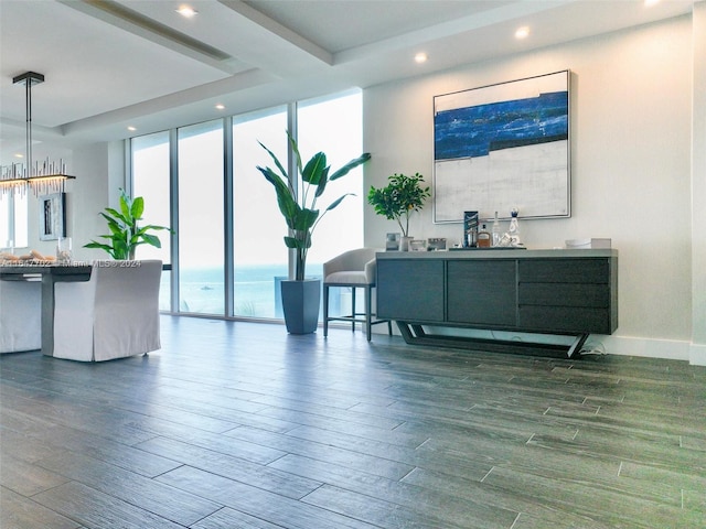 interior space featuring a water view and an inviting chandelier