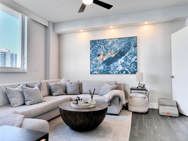 living room with hardwood / wood-style flooring and ceiling fan