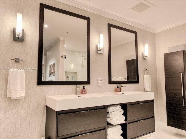 bathroom with vanity and ornamental molding