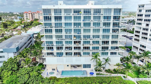 view of property featuring a community pool