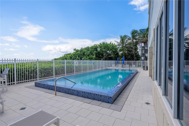 view of pool featuring a patio area