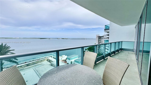 balcony featuring a water view