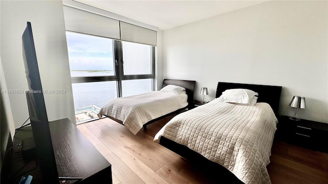 1331 Brickell Bay Dr Unit 1109, Miami, FL 33131 - bedroom with wood finished floors and a water view