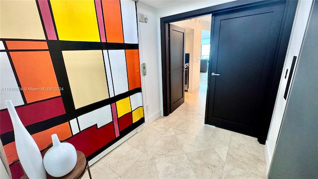 hall featuring light tile patterned flooring