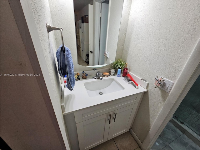 bathroom featuring tile patterned floors and vanity