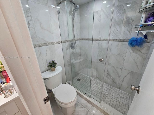 bathroom with toilet, tile walls, tile patterned floors, and a shower with shower door