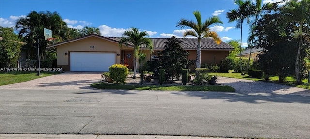 single story home with a garage