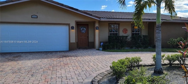 single story home with a garage