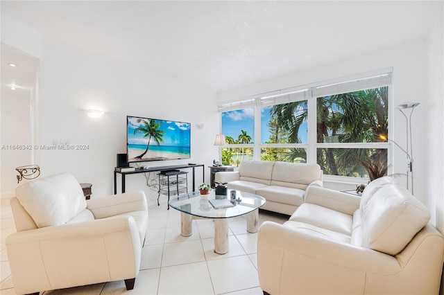 living room featuring a wealth of natural light and light tile patterned flooring