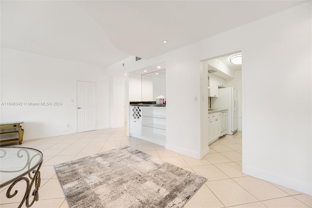 living room with recessed lighting, baseboards, and light tile patterned floors