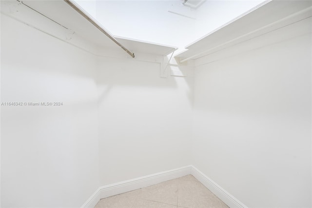 walk in closet featuring light tile patterned floors