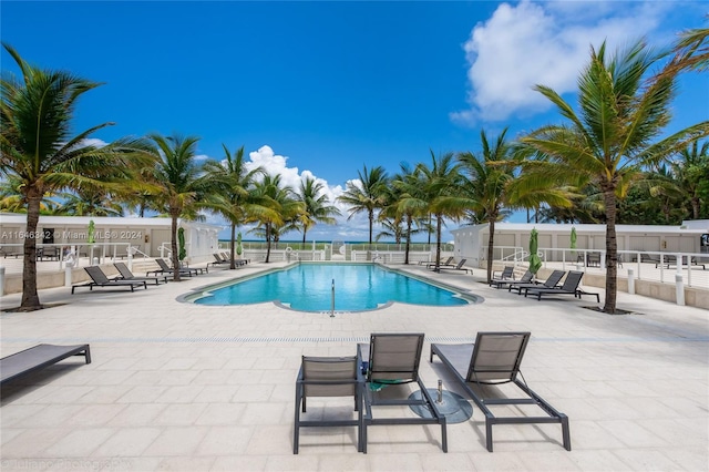 view of swimming pool with a patio area