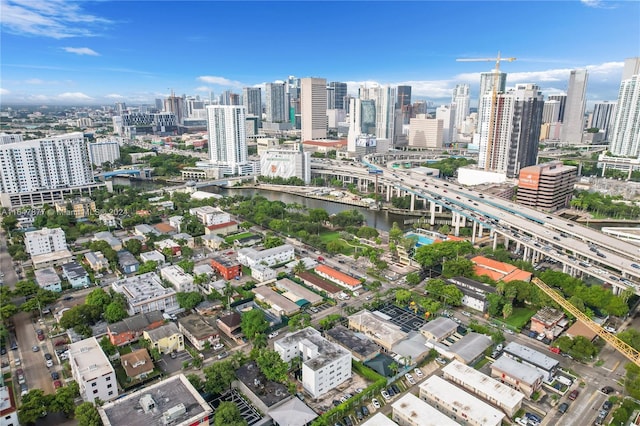 birds eye view of property with a view of city and a water view