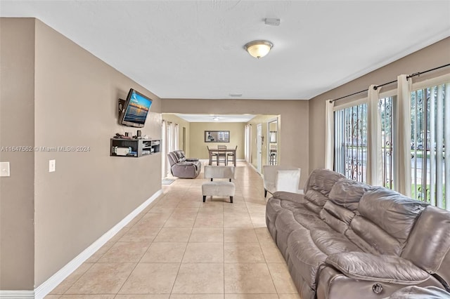 living room featuring plenty of natural light and light tile patterned flooring