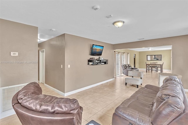 living room with light tile patterned flooring