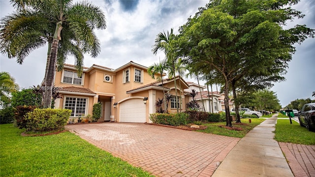 view of front of property featuring a front yard and a garage