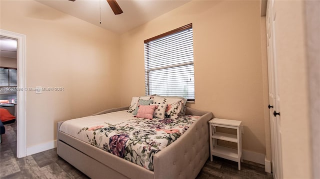 bedroom featuring ceiling fan and dark hardwood / wood-style floors