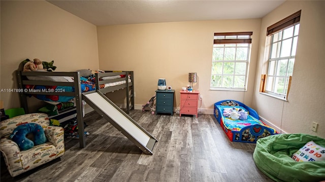 bedroom with wood-type flooring