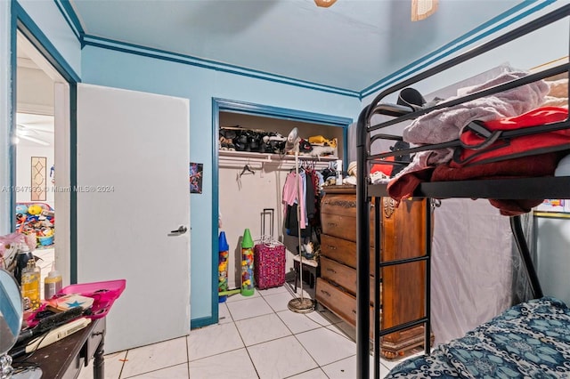 tiled bedroom with a closet