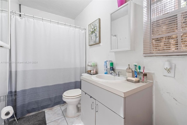 bathroom with toilet, vanity, a shower with curtain, and tile patterned floors