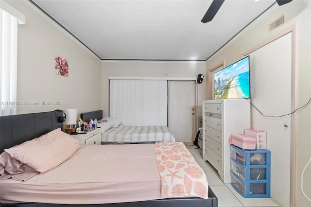 bedroom featuring ceiling fan and light tile patterned flooring