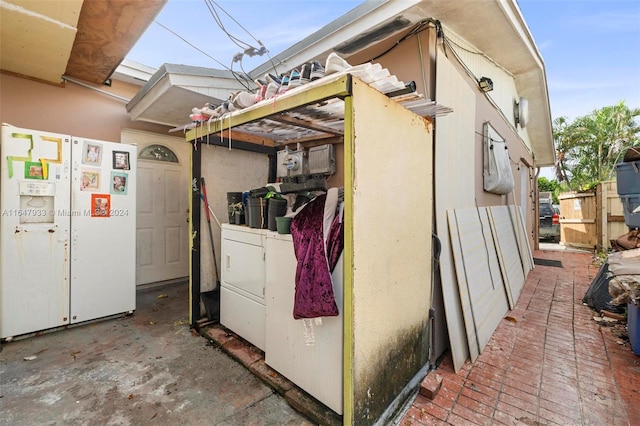 view of property exterior featuring washing machine and dryer