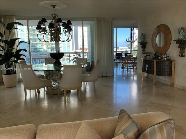 dining room featuring light tile patterned flooring and a notable chandelier