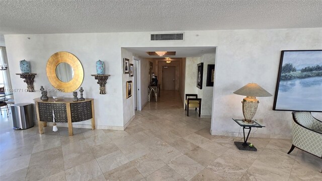 16400 Collins Ave Unit 646, Sunny Isles Beach, FL 33160 - living area featuring a textured ceiling and expansive windows