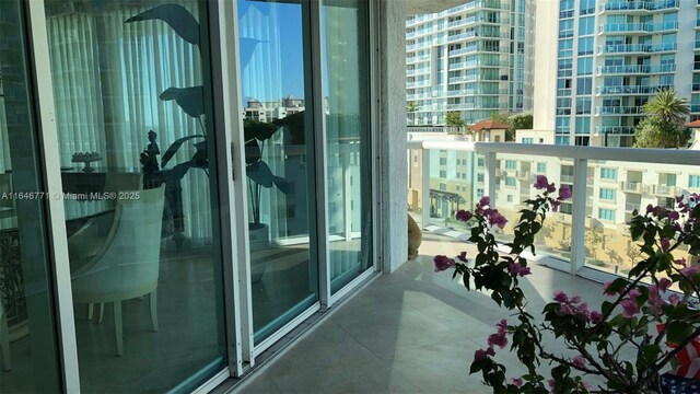 16400 Collins Ave Unit 646, Sunny Isles Beach, FL 33160 - kitchen with visible vents, a sink, white appliances, white cabinets, and light countertops