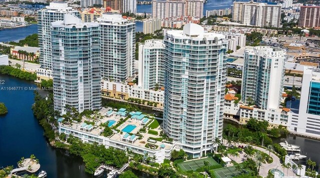 16400 Collins Ave Unit 646, Sunny Isles Beach, FL 33160 - dining room featuring a textured ceiling, expansive windows, and a chandelier