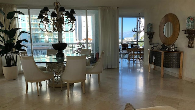 dining room featuring a chandelier and a wealth of natural light