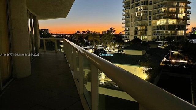 view of balcony at dusk