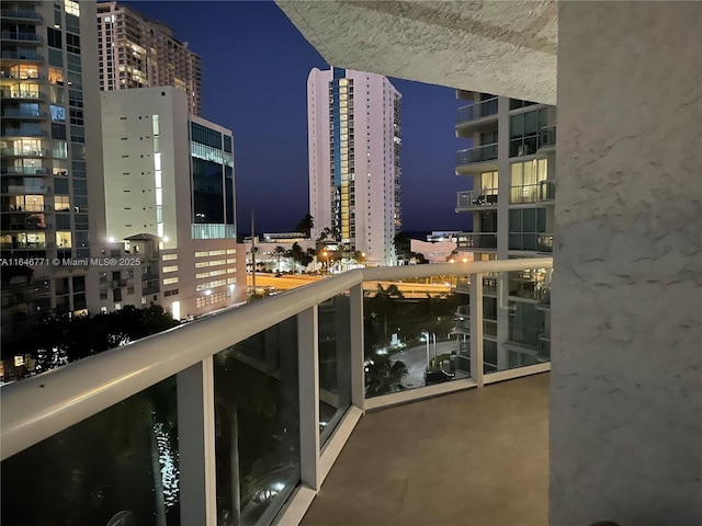 view of balcony at twilight