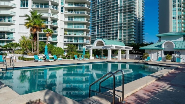 view of swimming pool featuring a gazebo and a patio area