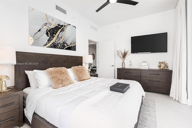 tiled bedroom with ceiling fan