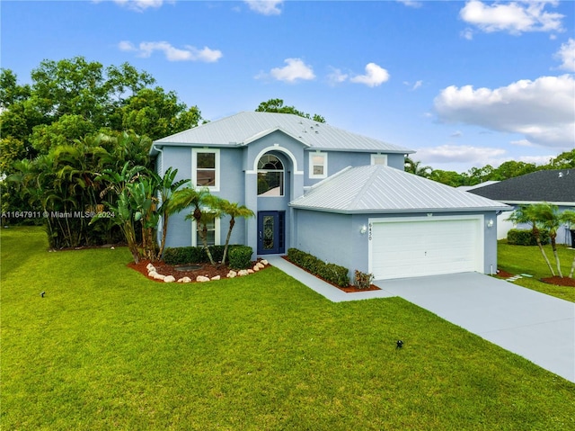 view of property featuring a front lawn and a garage