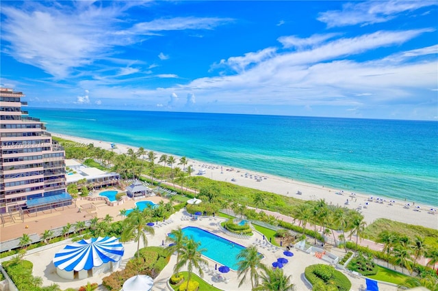 drone / aerial view featuring a view of the beach and a water view