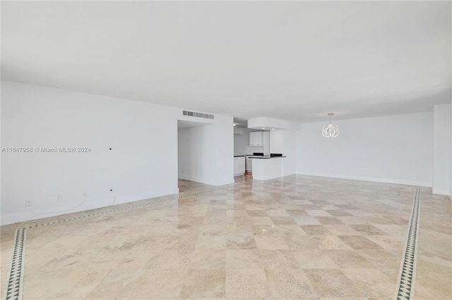 spare room featuring light tile patterned floors